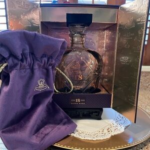 Empty Crown Royal bottle w/ stopper, box and purple drawstring bag.